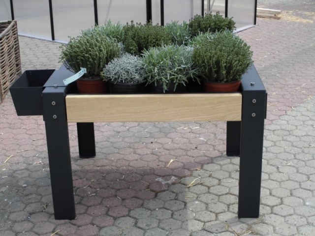 euroform w - urban furniture - ortofioriera in courtyard - therapeutical growing table  with plants and flowers in the garden - urban gardening