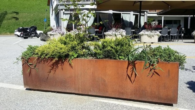 euroform w - urban furniture - Metal planter in front of shop - pollard with planter - urban flowerbeds