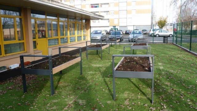 euroform w - urban furniture - ortofioriera in courtyard - therapeutical growing table  with plants and flowers in the garden - urban gardening