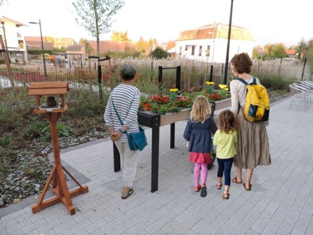 euroform w - urban furniture - ortofioriera in courtyard - therapeutical growing table  with plants and flowers in the garden - urban gardening