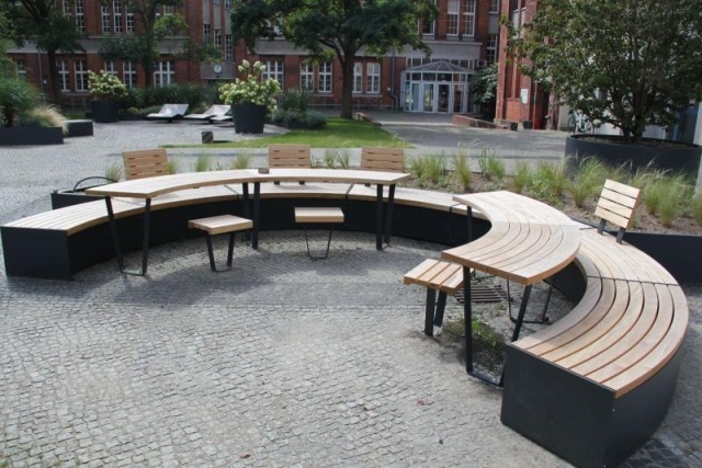 euroform w - sustainable street furniture - park bench wood - modular bench in the city centre of Berlin - big planter with bench in urban environment - sustainable seating for open space