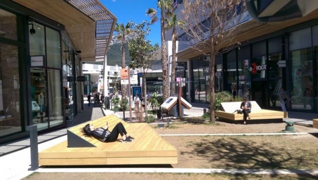 euroform w - street furniture - huge bench made of wood in shopping centre in France - designer bench made of wood for outside - wooden seating island for urban space - high quality street furniture