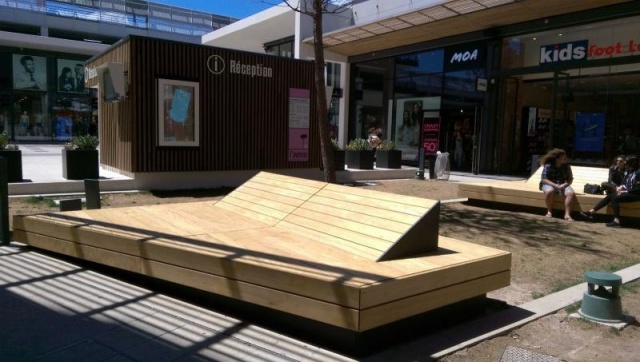 euroform w - street furniture - huge bench made of wood in shopping centre in France - designer bench made of wood for outside - wooden seating island for urban space - high quality street furniture