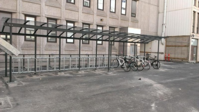 euroform w - street furniture - bike rack with shelter in a residential complex - Combibike Metal and glass shelter - velostation for cities
