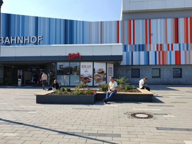 euroform w - street furniture - minimalist bench made of wood and metal for train station Cottbus - outdoor wooden seating island for train station Cottbus - customised street furniture