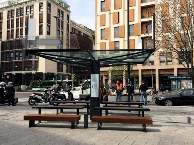 euroform w - urban furniture - minimalist wooden benches in city centre of Milan - wooden seatings for outdoors - customized bench with usb charger for public space  - glass and metal shelter in the centre of Milan - solar bench with smart technology and 