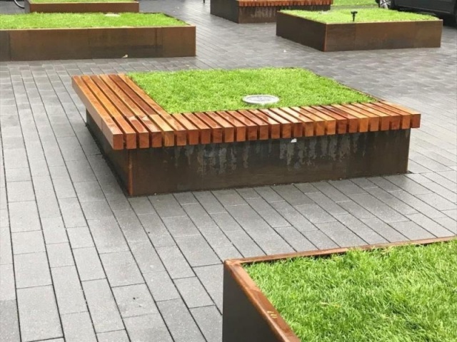 euroform w - urban furniture - wooden bench with corten steel planter for public place - rough and ready seatings for outdoors - big planter in corteen steel for urban space - customized street furniture