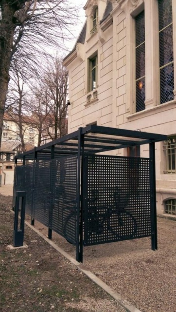 euroform w - urban furniture - bike storage in metal and glass - bike box - bike racks with bikes parked