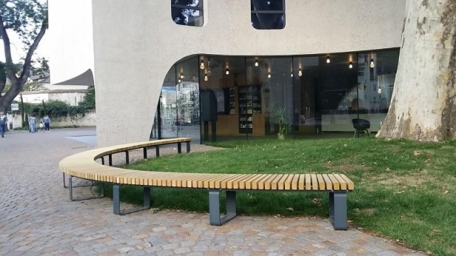 euroform w - urban furniture - wooden circular bench at public square - wooden tree seating - customized bench for Treehugger architecture